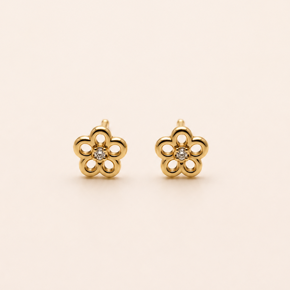 Aros flor de bebé con diamante en 18k