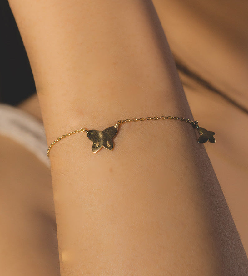 Pulsera doble mariposa en oro amarillo 18kt