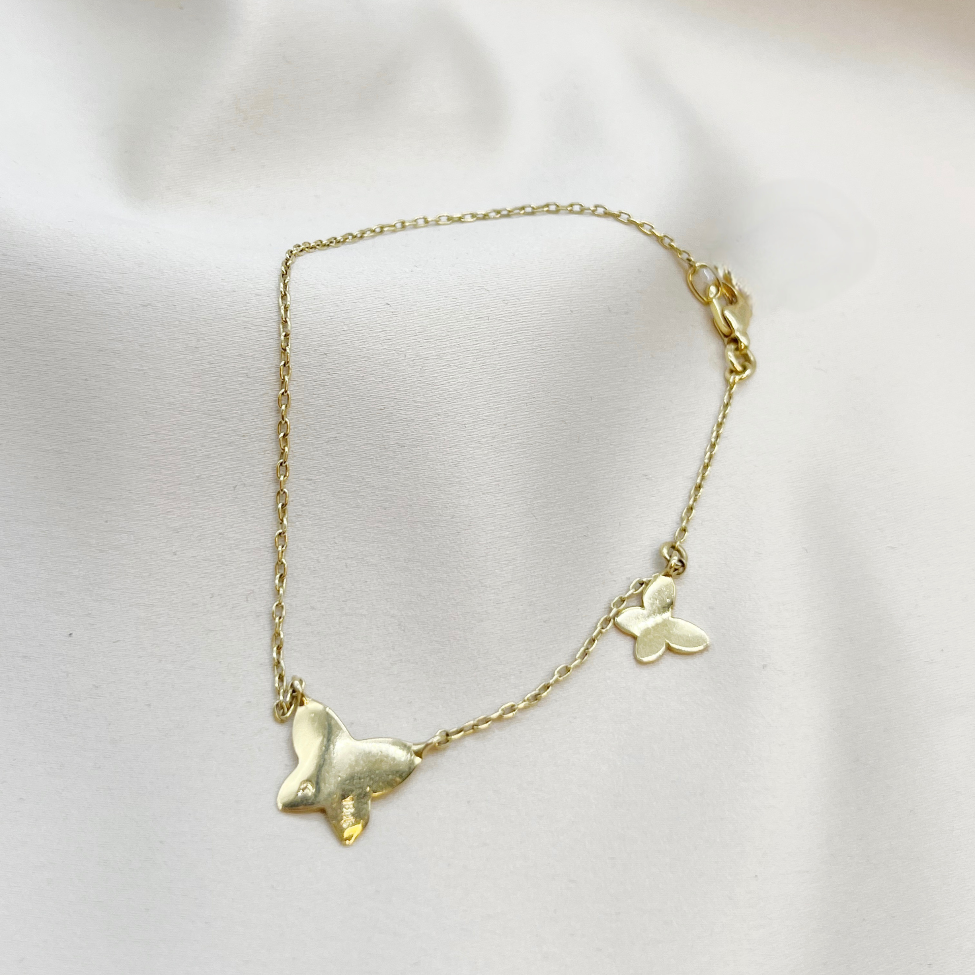 Pulsera doble mariposa en oro amarillo 18kt