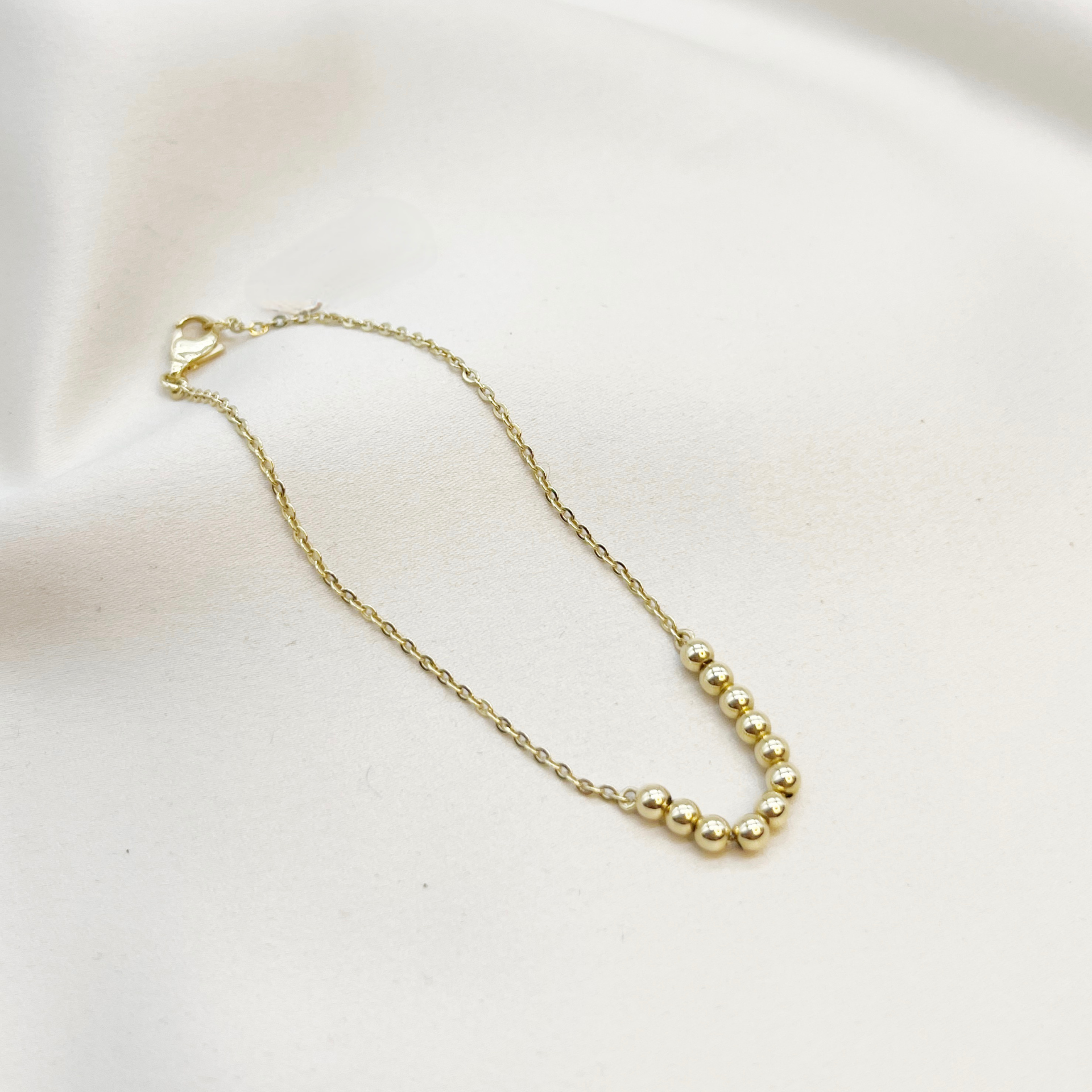 Pulsera de pelotitas de oro amarillo 18kt