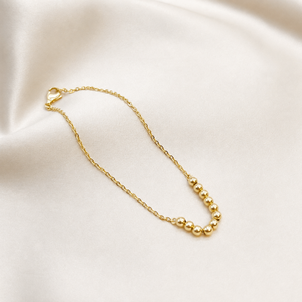 Pulsera de pelotitas de oro amarillo 18kt