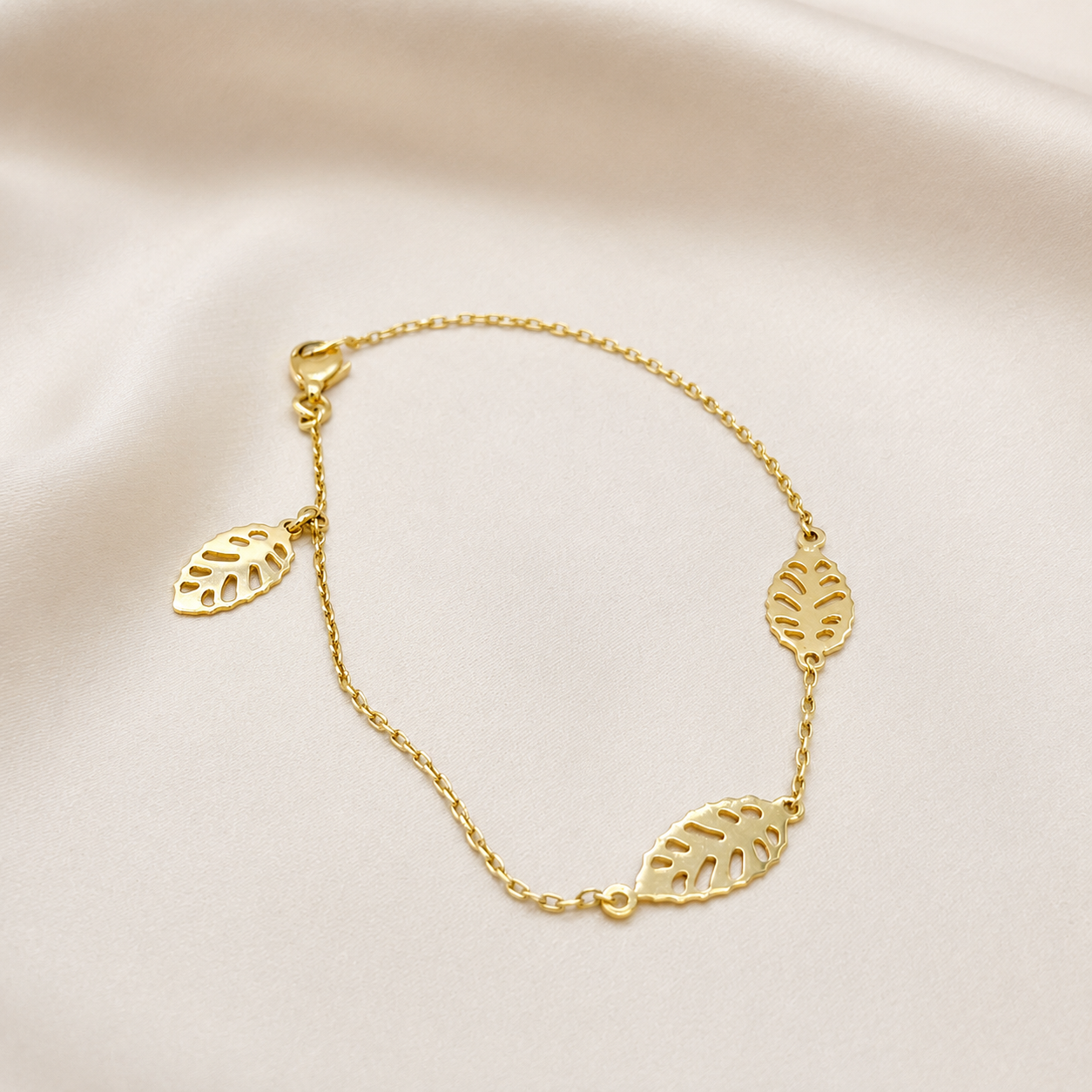 Pulsera trio de hojas caladas en oro amarillo 18kt